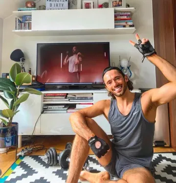 Member smiling mid-workout